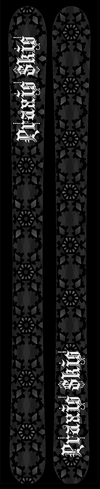 A matching pair of skis with a black geometric pattern on them