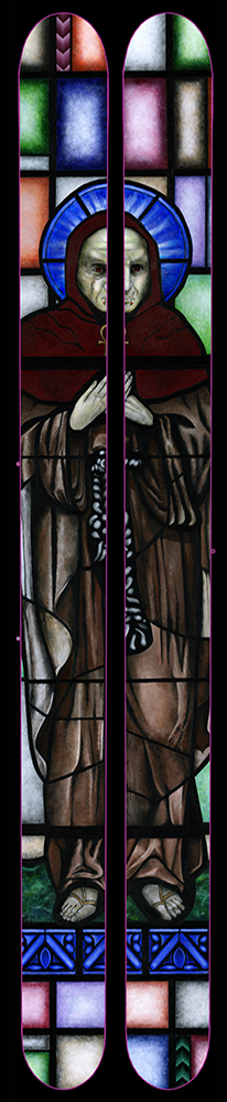 Skis with a design on them to look like a vampire on stained glass windows